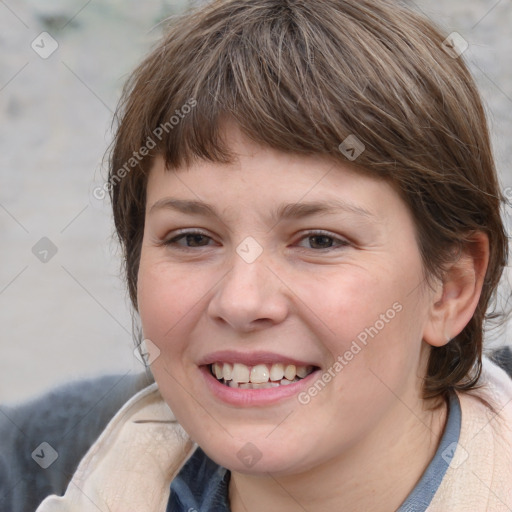 Joyful white young-adult female with medium  brown hair and blue eyes