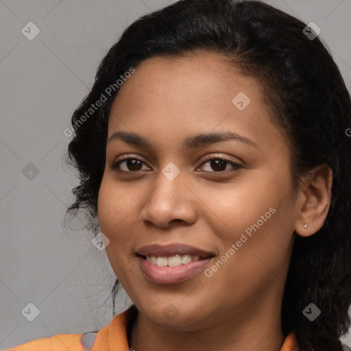 Joyful latino young-adult female with long  black hair and brown eyes