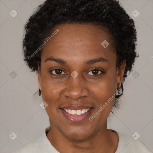 Joyful black adult female with short  brown hair and brown eyes