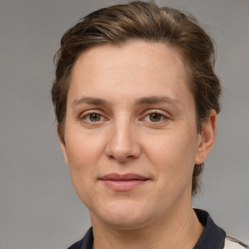 Joyful white adult female with short  brown hair and grey eyes