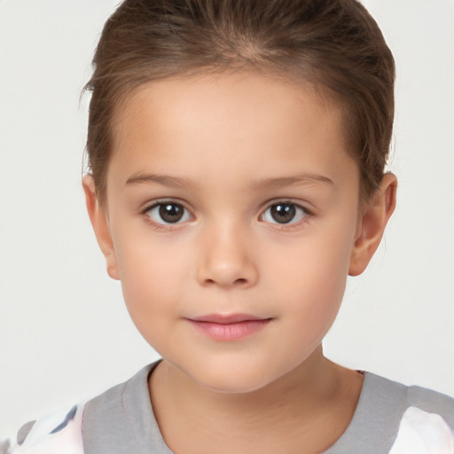 Joyful white child female with short  brown hair and brown eyes