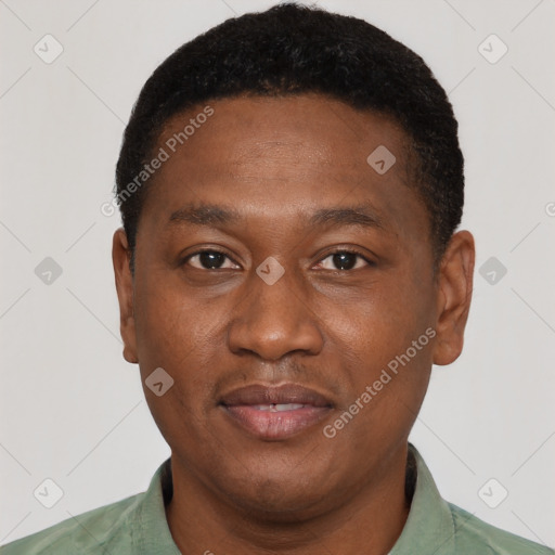 Joyful latino young-adult male with short  brown hair and brown eyes
