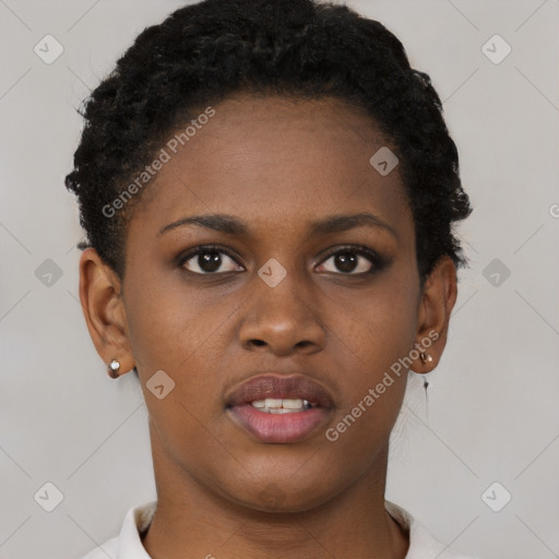 Joyful black young-adult female with short  brown hair and brown eyes