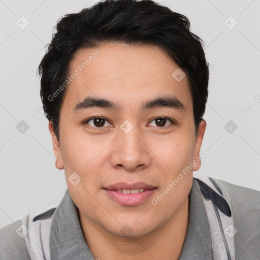 Joyful asian young-adult male with short  brown hair and brown eyes