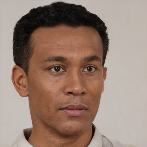 Neutral black young-adult male with short  brown hair and brown eyes