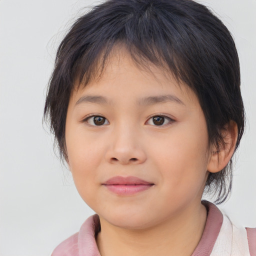 Joyful asian child female with medium  brown hair and brown eyes