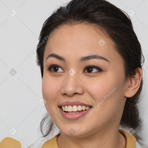 Joyful asian young-adult female with medium  brown hair and brown eyes