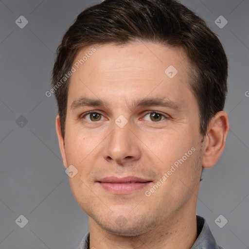 Joyful white adult male with short  brown hair and brown eyes