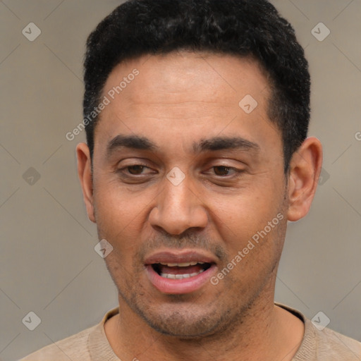 Joyful latino young-adult male with short  black hair and brown eyes