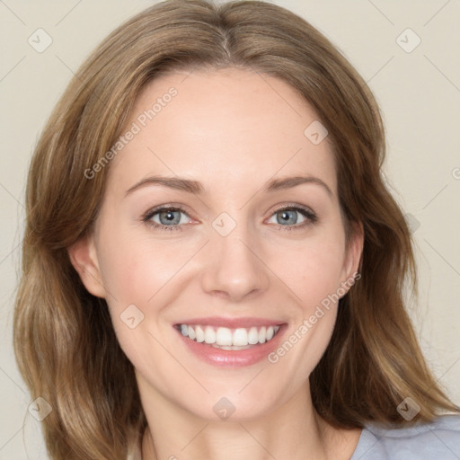 Joyful white young-adult female with medium  brown hair and green eyes