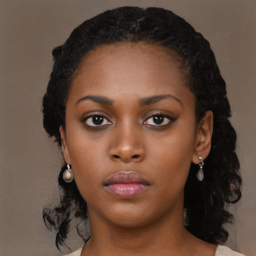 Neutral black young-adult female with medium  black hair and brown eyes