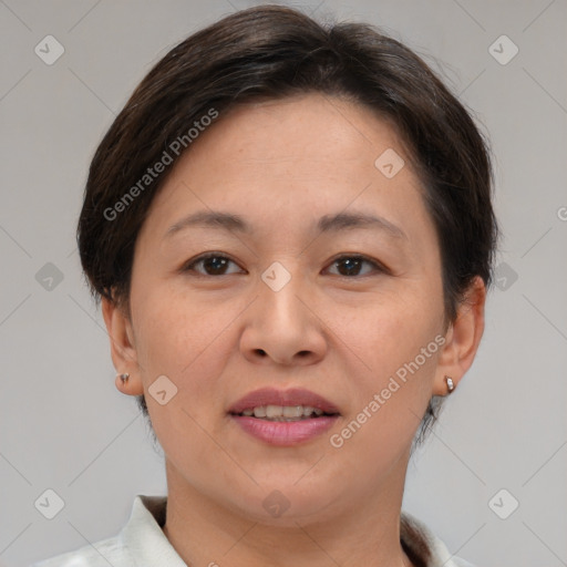 Joyful white adult female with short  brown hair and brown eyes