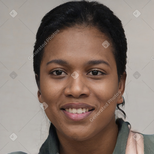 Joyful black young-adult female with short  black hair and brown eyes