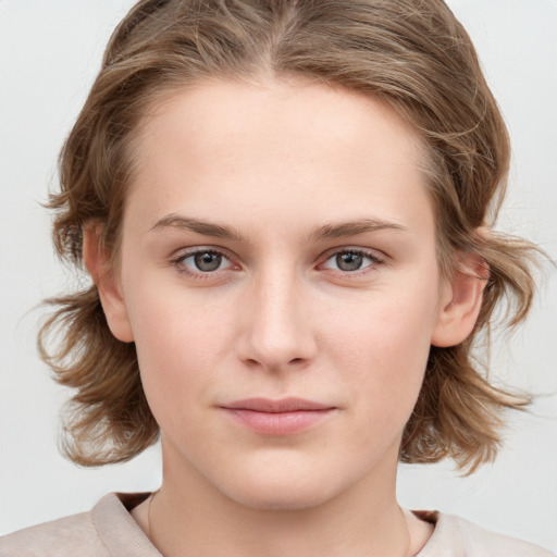 Neutral white young-adult female with medium  brown hair and blue eyes