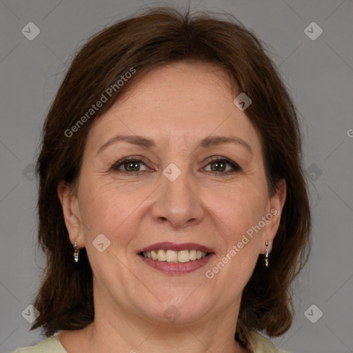 Joyful white adult female with medium  brown hair and brown eyes