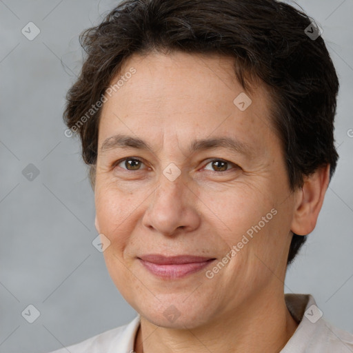 Joyful white adult female with short  brown hair and brown eyes