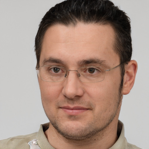 Joyful white adult male with short  brown hair and brown eyes