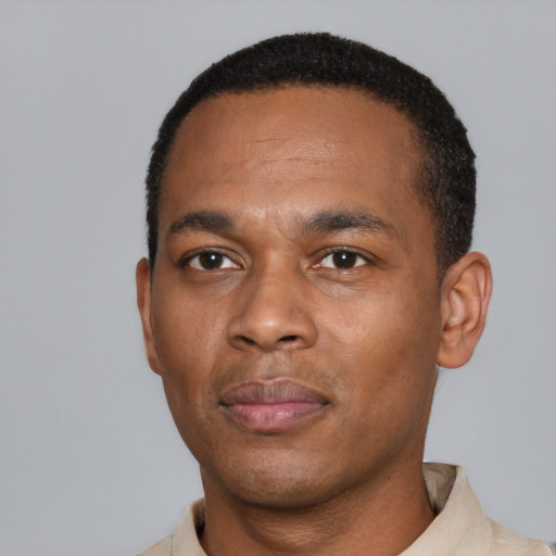 Neutral black young-adult male with short  black hair and brown eyes