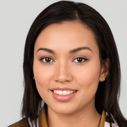 Joyful white young-adult female with long  brown hair and brown eyes