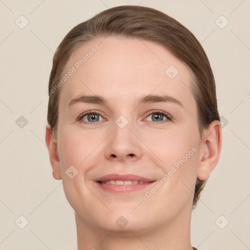 Joyful white young-adult female with short  brown hair and grey eyes