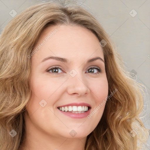 Joyful white young-adult female with long  brown hair and green eyes