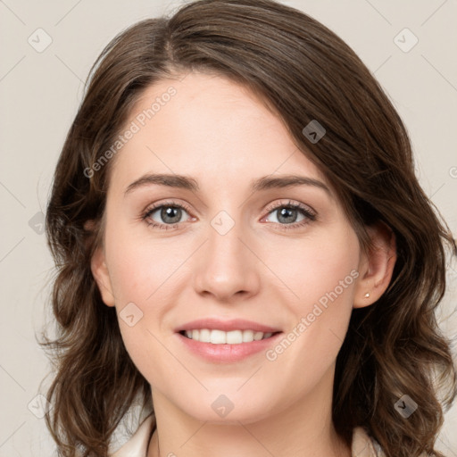 Joyful white young-adult female with medium  brown hair and green eyes