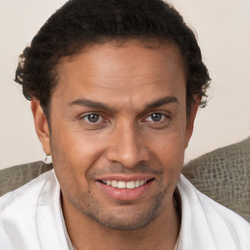 Joyful white adult male with short  brown hair and brown eyes