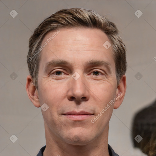 Joyful white adult male with short  brown hair and grey eyes