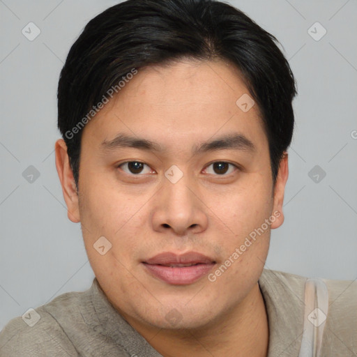 Joyful asian young-adult male with short  brown hair and brown eyes