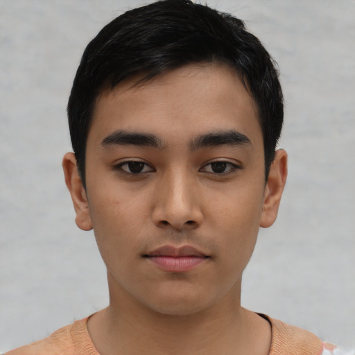 Neutral latino young-adult male with short  black hair and brown eyes