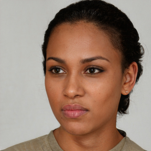 Neutral black young-adult female with short  black hair and brown eyes