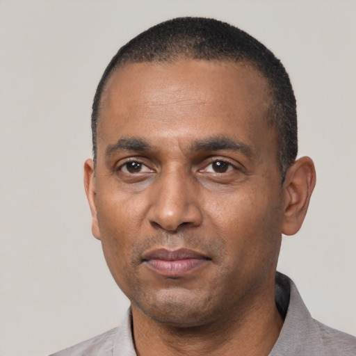 Neutral black adult male with short  black hair and brown eyes