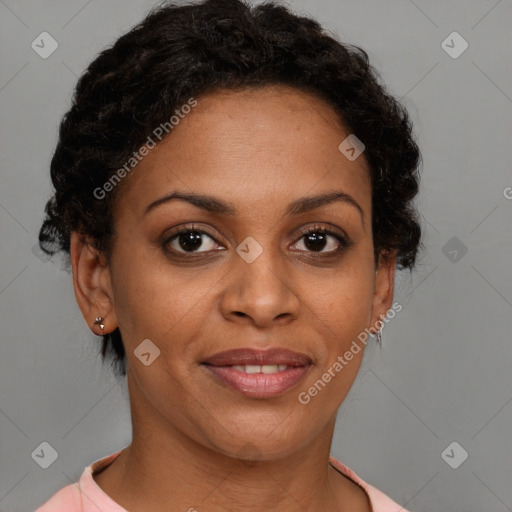 Joyful black young-adult female with short  brown hair and brown eyes