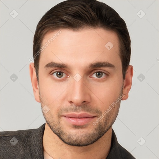 Joyful white young-adult male with short  brown hair and brown eyes