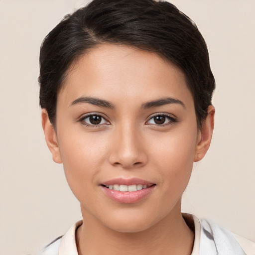 Joyful white young-adult female with short  brown hair and brown eyes