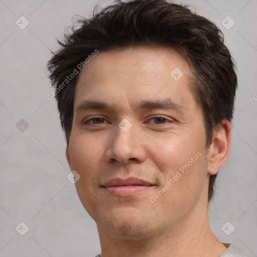 Joyful white adult male with short  brown hair and brown eyes