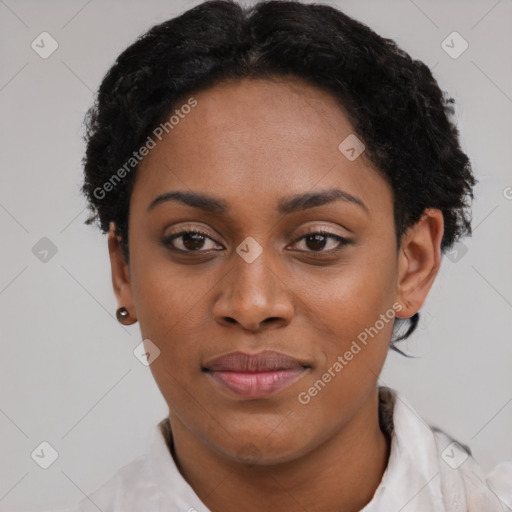 Joyful black young-adult female with short  black hair and brown eyes