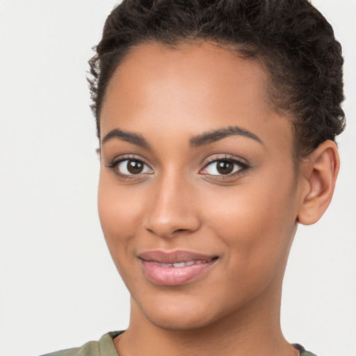 Joyful latino young-adult female with short  brown hair and brown eyes