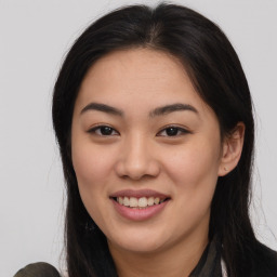 Joyful asian young-adult female with long  brown hair and brown eyes