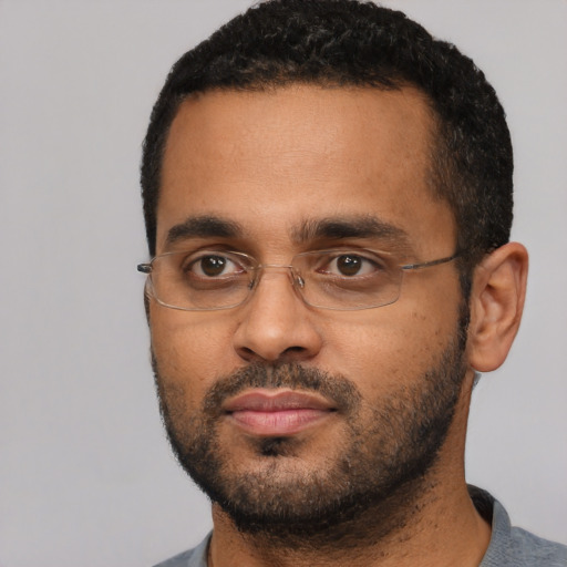 Neutral black adult male with short  black hair and brown eyes