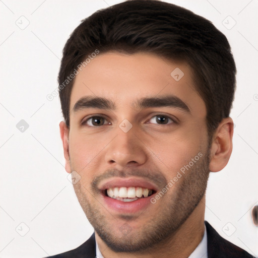 Joyful white young-adult male with short  black hair and brown eyes