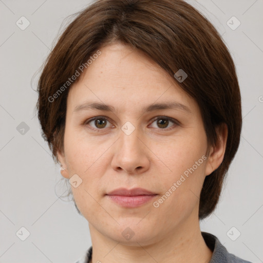 Joyful white adult female with medium  brown hair and brown eyes