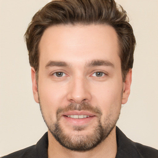 Joyful white young-adult male with short  brown hair and brown eyes