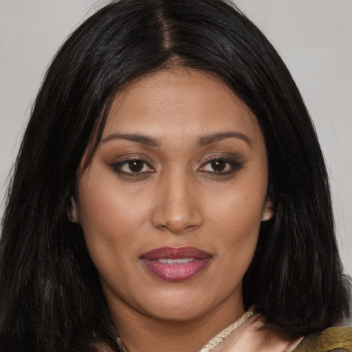 Joyful asian young-adult female with long  brown hair and brown eyes