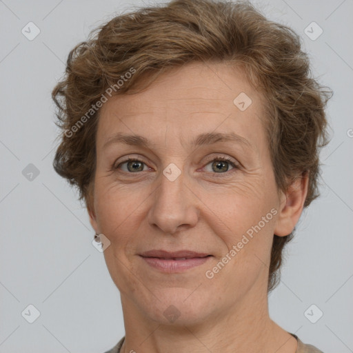 Joyful white adult female with short  brown hair and brown eyes