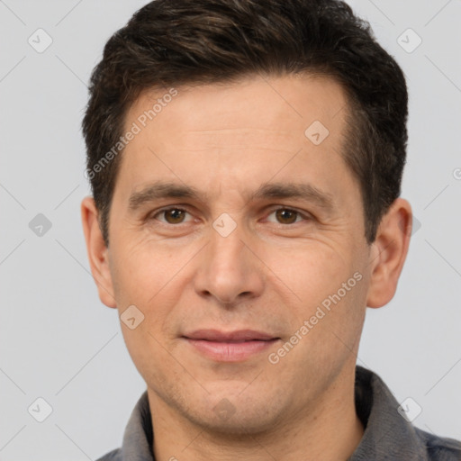 Joyful white adult male with short  brown hair and brown eyes