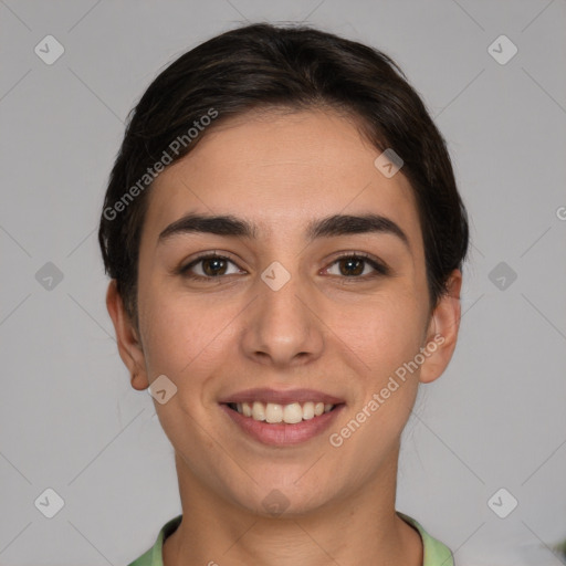 Joyful white young-adult female with short  brown hair and brown eyes