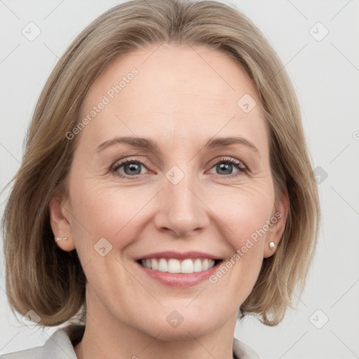 Joyful white adult female with medium  brown hair and grey eyes