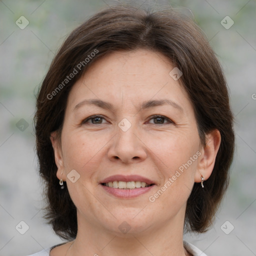 Joyful white adult female with medium  brown hair and brown eyes