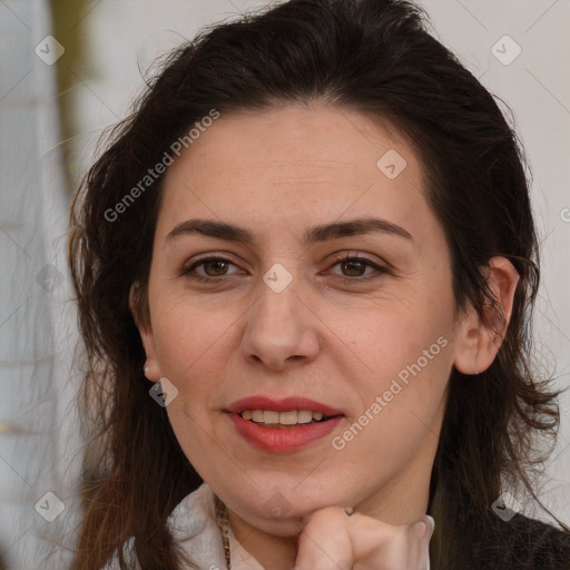 Joyful white adult female with long  brown hair and brown eyes